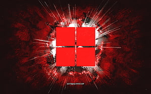 Windows 11 Red Grunge Logo with Dramatic Light Burst on Dark Textured Background HD wallpaper