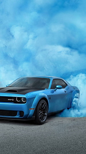 Blue Dodge Challenger SRT Hellcat drifting with smoke on asphalt HD phone wallpaper