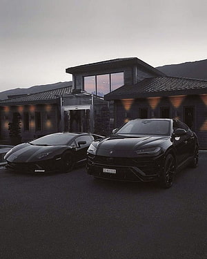 Black Lamborghini Urus and Huracan Parked in Front of Modern Luxury Residence at Dusk HD phone wallpaper