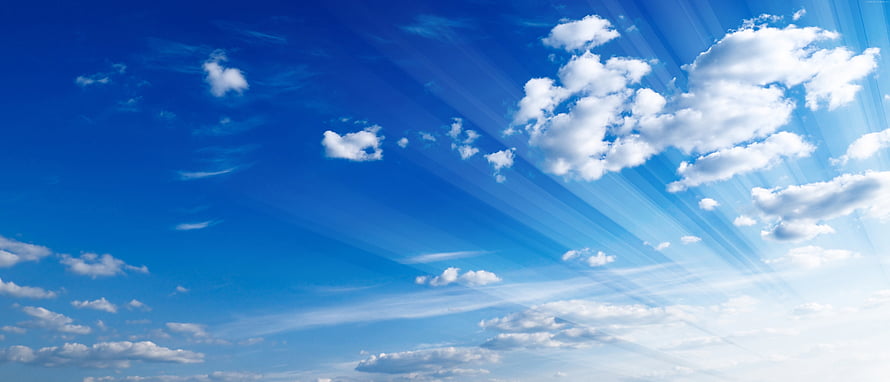 Vast Blue Sky With Fluffy White Clouds And Radiant Sunbeams HD wallpaper