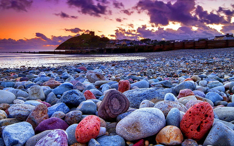 St Michael's Mount Sunset View from Porthmeor Beach with Colorful Pebbles HD wallpaper