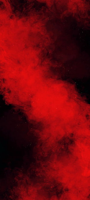 Vibrant Red Smoke Clouds Swirling in Dark Space with Glittering Particles HD phone wallpaper