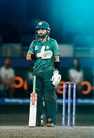 Babar Azam in Pakistan Green Kit Holding Cricket Bat at the Stumps HD phone wallpaper