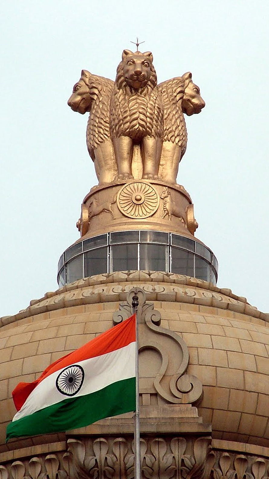 Golden Lion Capital of Ashoka atop the Indian Parliament Building with National Flag HD phone wallpaper