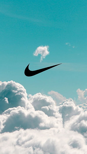 Nike Swoosh Logo Floating Above Fluffy White Clouds in a Clear Blue Sky HD phone wallpaper