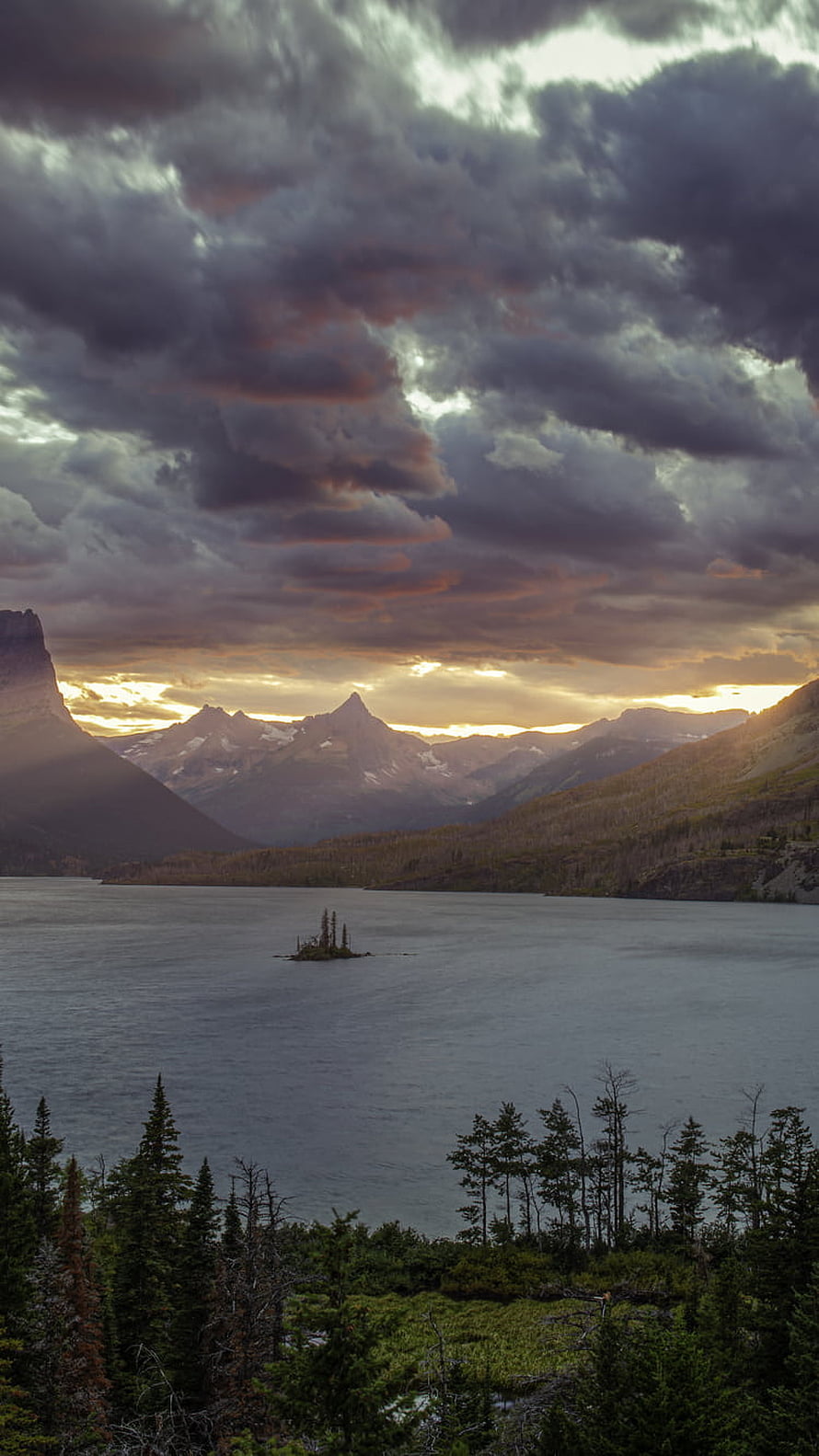 St Mary Lake at Dusk in Glacier National Park with Dramatic Clouds and Mountain Peaks HD phone wallpaper
