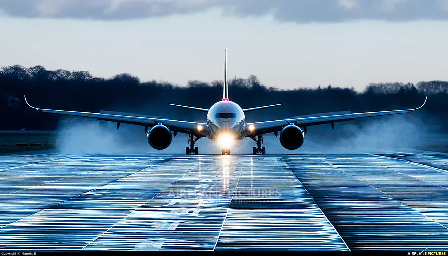 Airbus A350-1000 Landing on Wet Runway at Dusk with Headlights On HD wallpaper