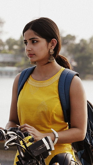 Kashmira Pardeshi in Yellow Top with Blue Backpack Near Water HD phone wallpaper
