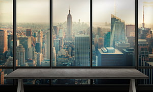 Modern Office Desk with Panoramic New York City Skyline View HD wallpaper
