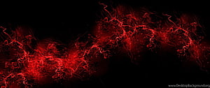Vibrant red ink swirls and fluid paint splashes on a deep black background HD wallpaper