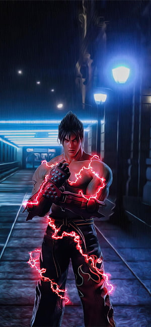 Jin Kazama from Tekken 7 channeling red energy in a rainy neon-lit city street at night HD phone wallpaper