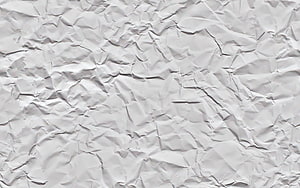 Crumpled White Paper Texture Background with Soft Shadows and Wrinkled Surface HD wallpaper