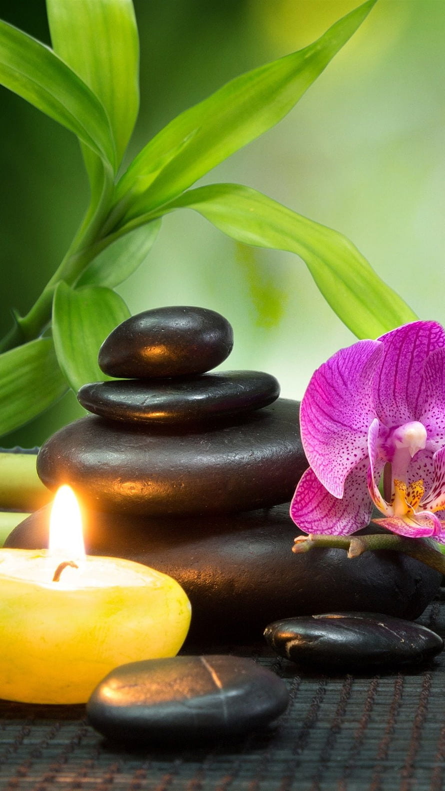 Serene Spa Still Life with Stacked Zen Stones, Purple Orchid, and Lit Candle HD phone wallpaper