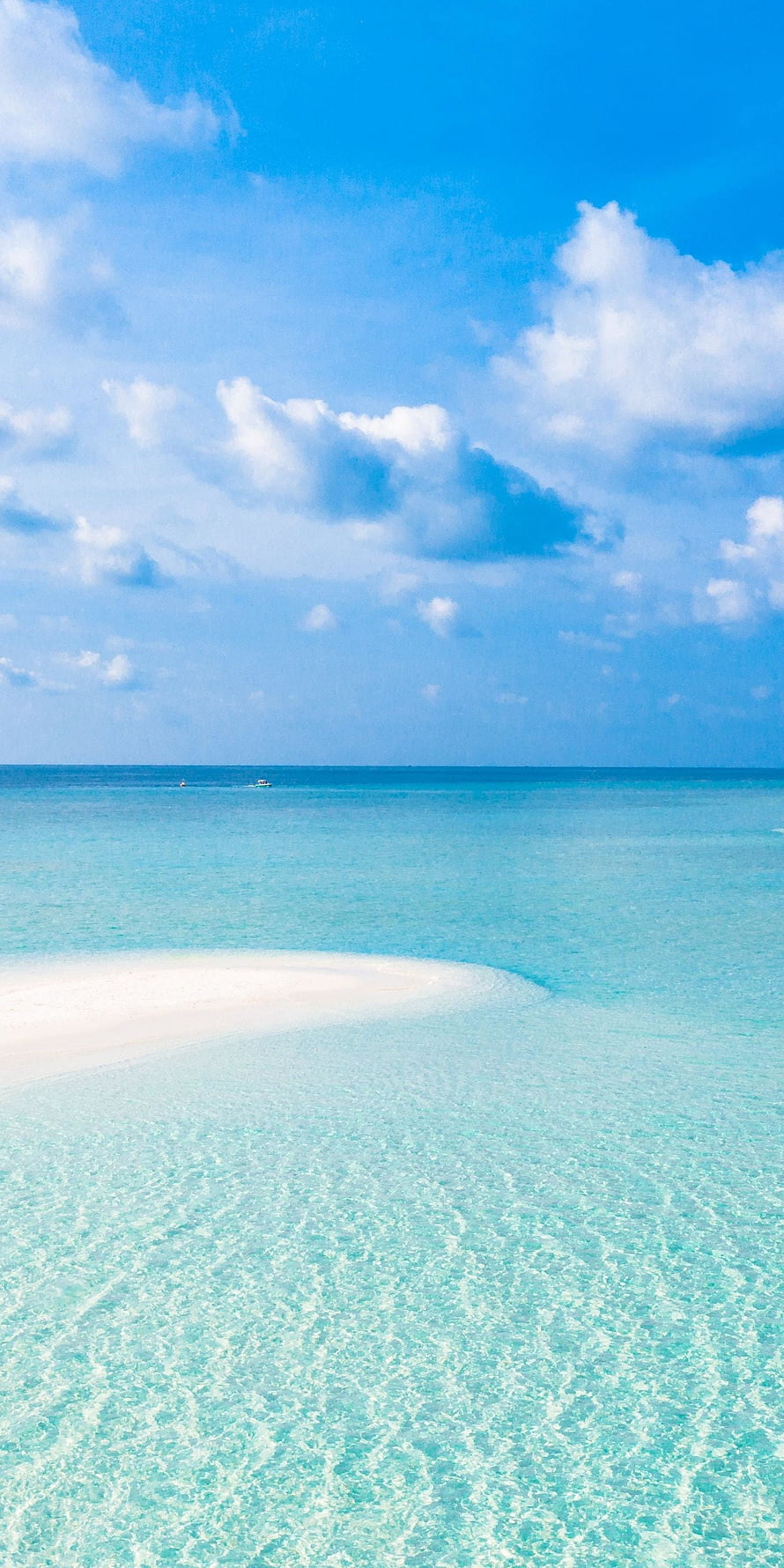 Serene Tropical Beach with Turquoise Water and White Sand Under a Bright Blue Sky HD phone wallpaper