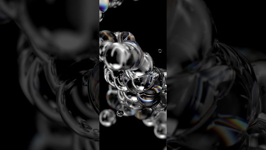 Abstract 3D Render of Shiny Metallic Spheres with Iridescent Reflections on Black Background HD wallpaper
