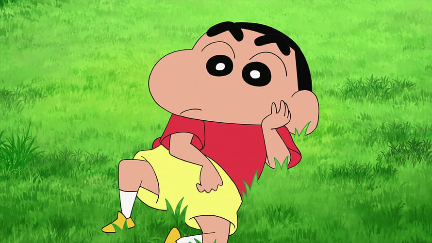 Crayon Shin-chan Anime Character Sitting in Green Grass Field HD wallpaper