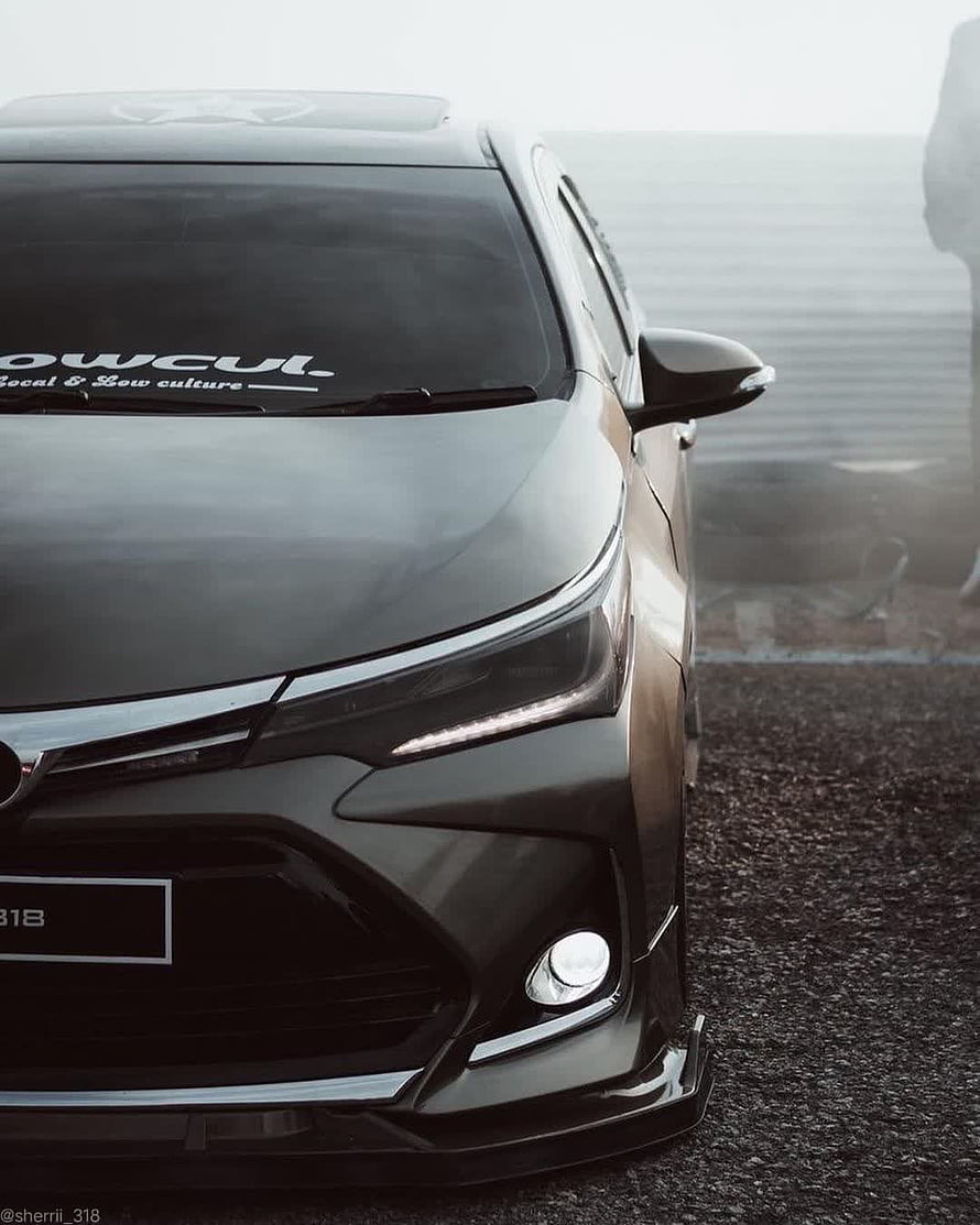 Black Toyota Corolla Front Fascia Close-Up with LED Headlights and Sporty Bumper HD phone wallpaper