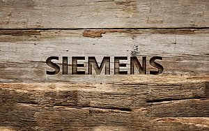 Siemens Brand Name Carved Into Weathered Rustic Wooden Planks HD wallpaper