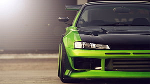 Vibrant Green and Black Widebody Sports Car Front End Close-Up HD wallpaper