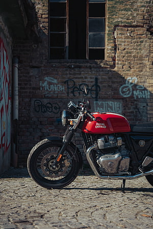 Red Royal Enfield Classic Motorcycle Parked on Cobblestone Street HD phone wallpaper
