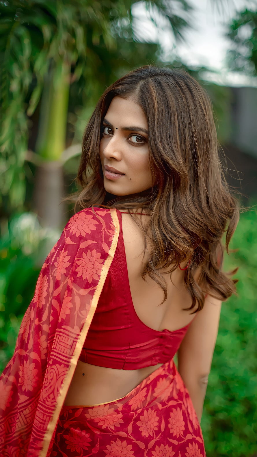 Woman in Red Floral Saree with Open Back Blouse in Garden, Malavika mohanan, tamil actress HD phone wallpaper