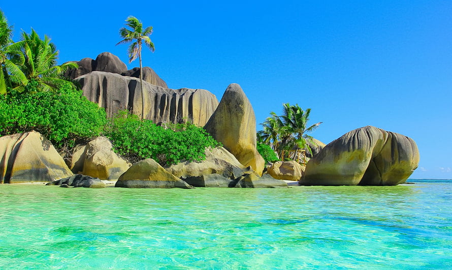 Tropical Beach with Giant Granite Boulders and Turquoise Water HD wallpaper