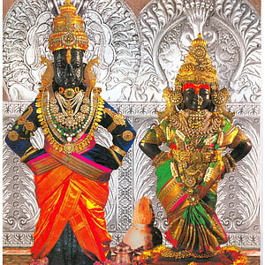 Ornate Vitthal and Rukmini Deity Statues in Traditional Temple Attire HD phone wallpaper