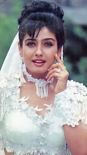Raveena Tandon in Elegant White Bridal Attire with Floral Necklace and Veil HD phone wallpaper