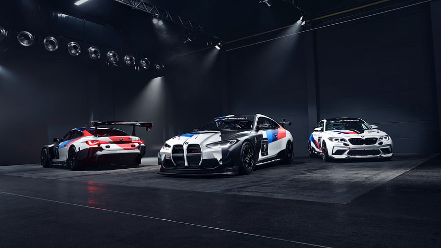 BMW M4 GT3 Racing Cars in Dark Studio with Dramatic Lighting HD wallpaper