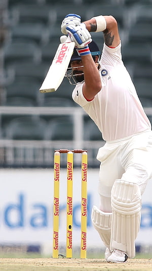 Virat Kohli Playing Cricket Shot in White Uniform HD phone wallpaper