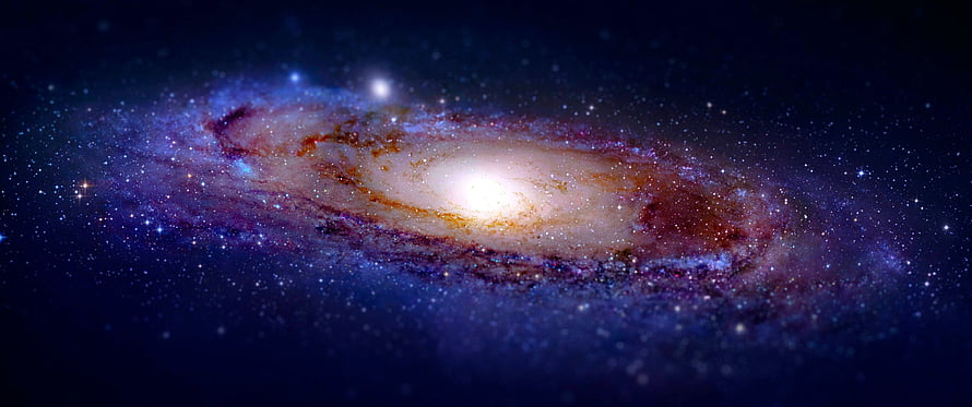 Stunning Spiral Galaxy with Bright Core and Colorful Dust Lanes in Deep Space HD wallpaper