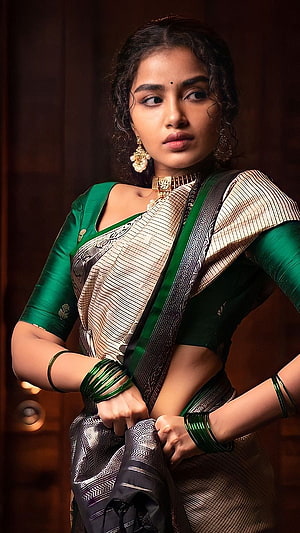 Anupama Parmeshwaran in a Green and Silver Silk Saree with Traditional Gold Jewelry HD phone wallpaper