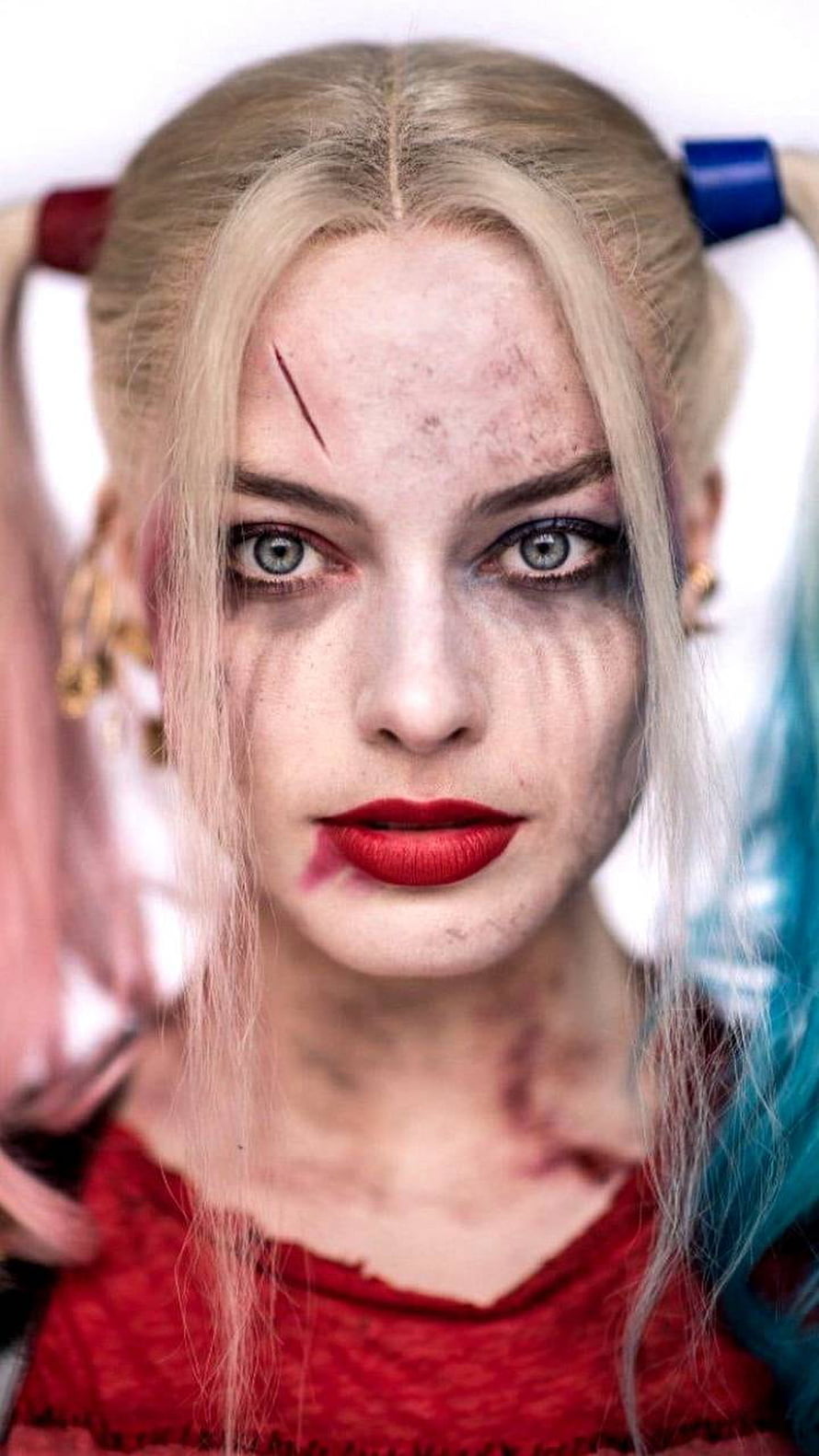 Harley Quinn Close-Up Portrait with Distressed Makeup and Dual-Toned Pigtails HD phone wallpaper