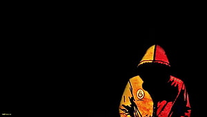 Silhouette of a hooded figure in a red and yellow jacket against a black background HD wallpaper