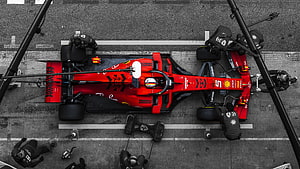 Aerial View of Ferrari F1 Car Pit Stop with Crew HD wallpaper