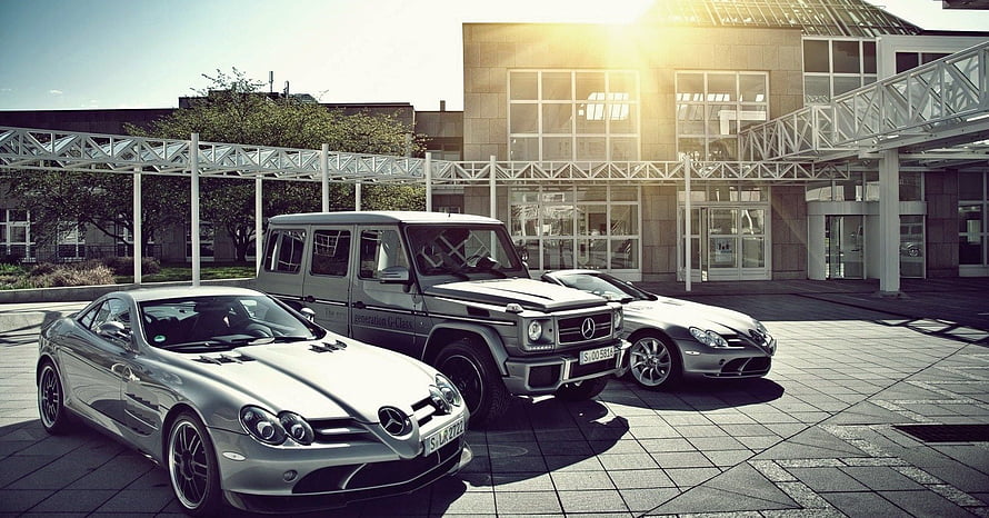 Three Silver Mercedes-Benz Vehicles Parked in Front of Modern Corporate Architecture HD wallpaper