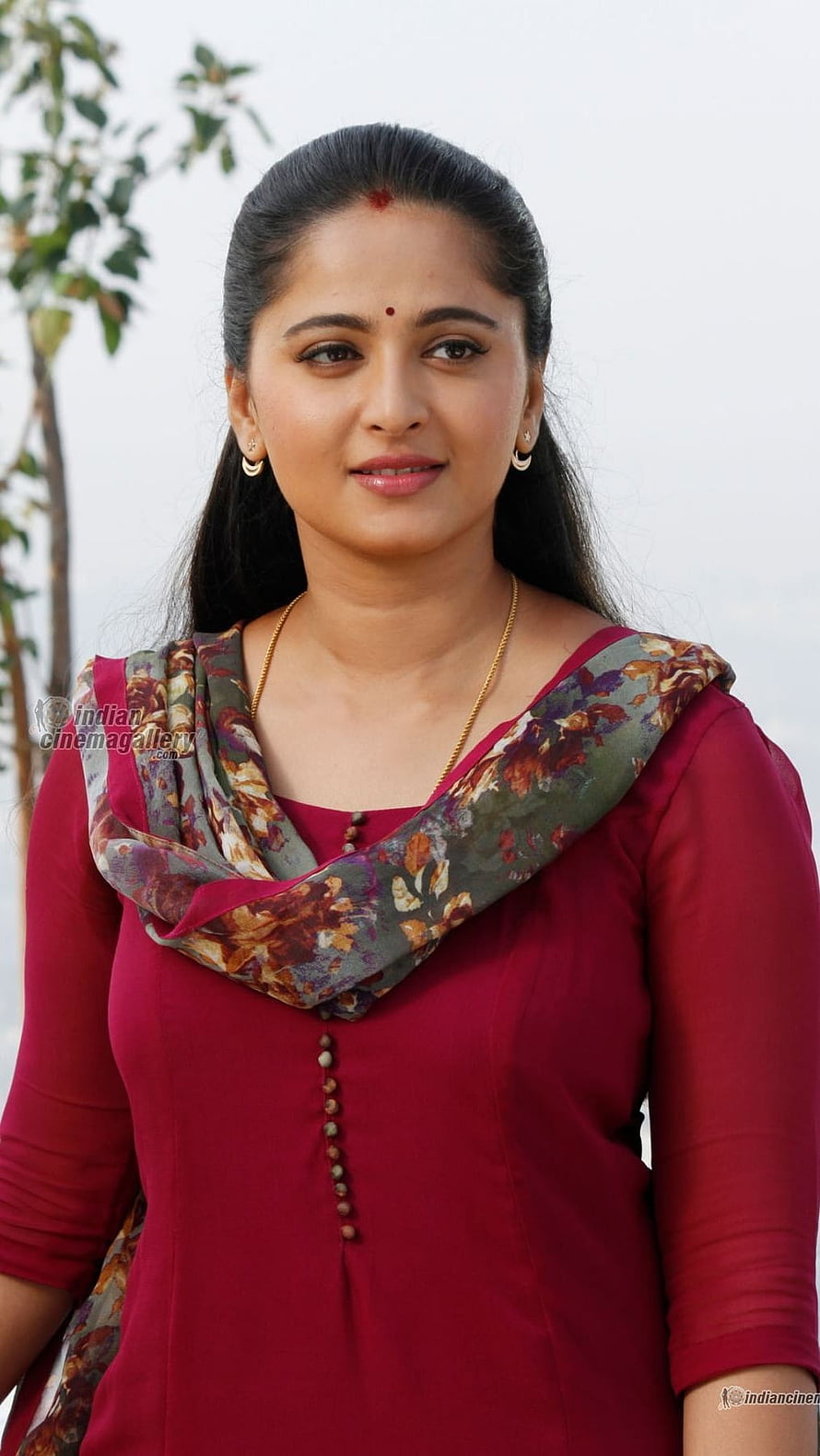 Anushka Shetty in a Red Kurti with Floral Dupatta Portrait HD phone wallpaper