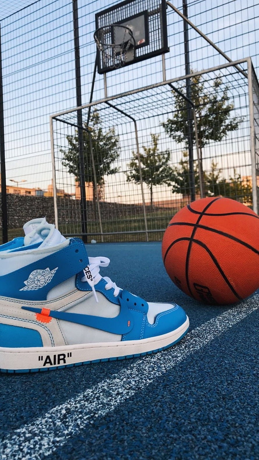 Off-White x Air Jordan 1 High in Blue and White on an Outdoor Basketball Court HD phone wallpaper