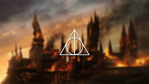 Harry Potter Deathly Hallows Symbol Over Burning Hogwarts Castle at Dusk HD wallpaper
