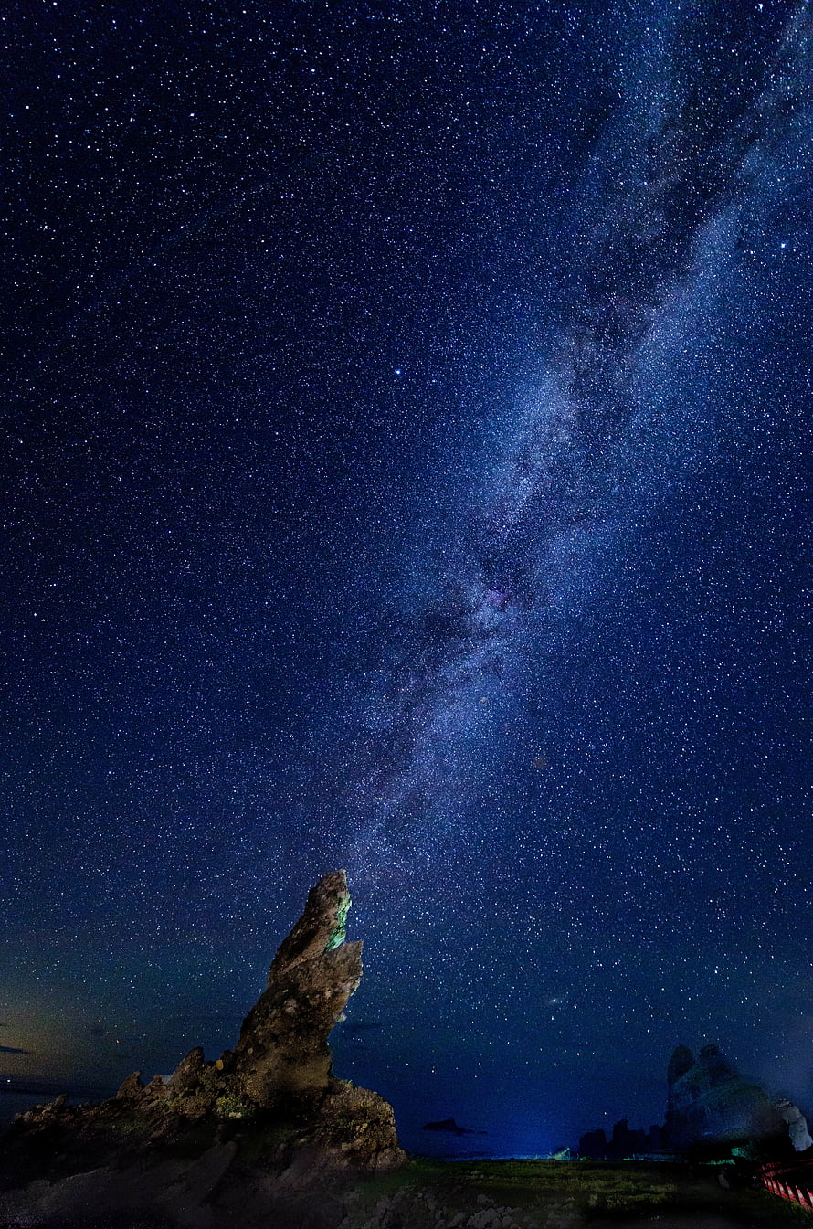 Milky Way Galaxy Arching Over Coastal Rock Formations Under a Starry Night Sky HD phone wallpaper