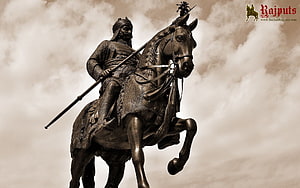 Majestic Bronze Statue of a Rajput Warrior on Horseback with Spear HD wallpaper