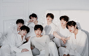 BTS members in all white outfits posing together with starry background HD wallpaper