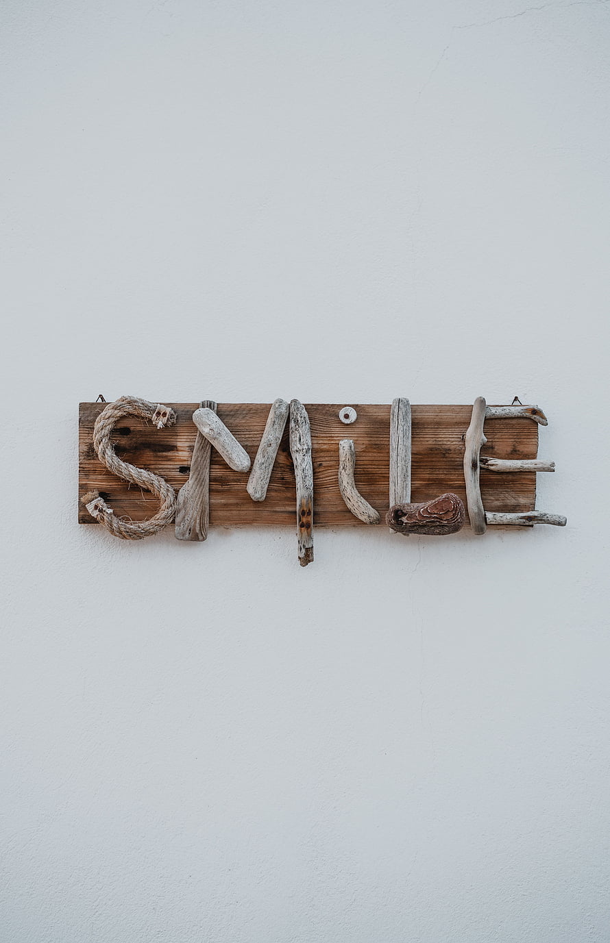 Handcrafted Driftwood and Rope Smile Sign on Rustic Wooden Plaque HD phone wallpaper