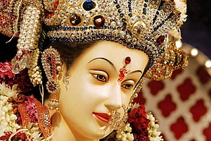 Ornate Durga Devi Idol Adorned With Jewels And Fresh Floral Garlands HD wallpaper