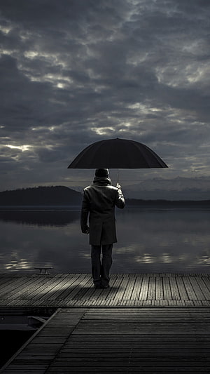 Solitary Man Standing on Wooden Dock with Umbrella Under Stormy Sky, Alone, Alone Man, Man Sad HD phone wallpaper