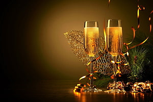 Champagne Toast with Golden Ribbons and Pine Branches for Christmas and New Year Celebrations HD wallpaper