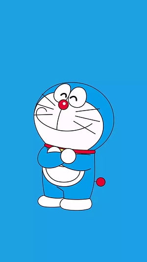 Doraemon Smiling with Crossed Arms on a Solid Blue Background HD phone wallpaper