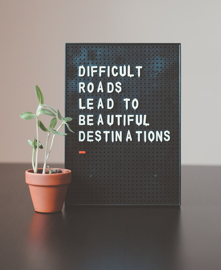 Motivational Letter Board with Potted Plant on Dark Table HD phone wallpaper
