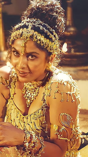 Ramya Krishnan in ornate gold jewelry and traditional Indian costume HD phone wallpaper