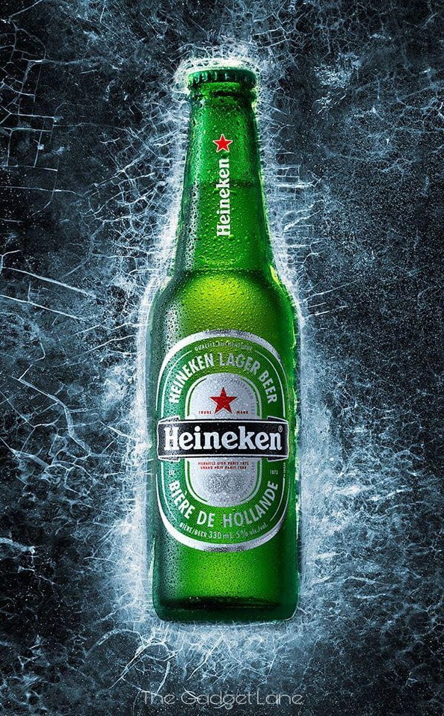 Chilled Heineken Lager Beer Bottle with Condensation on Icy Dark Background HD phone wallpaper